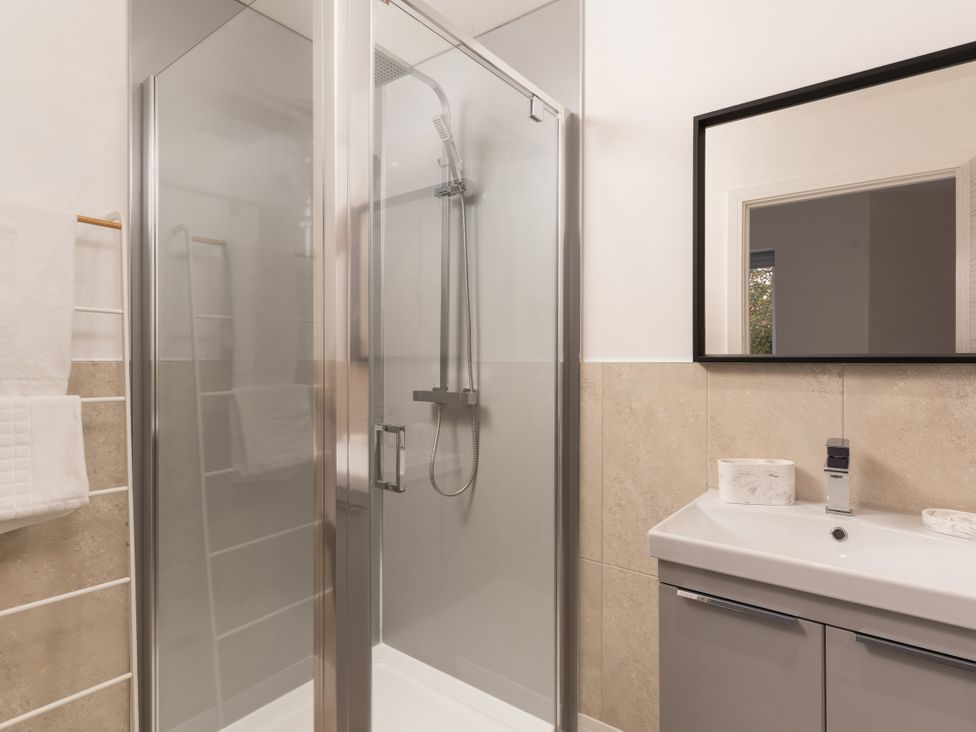 A bathroom with a shower and sink at Estuary Watch in Lelant near Carbis Bay