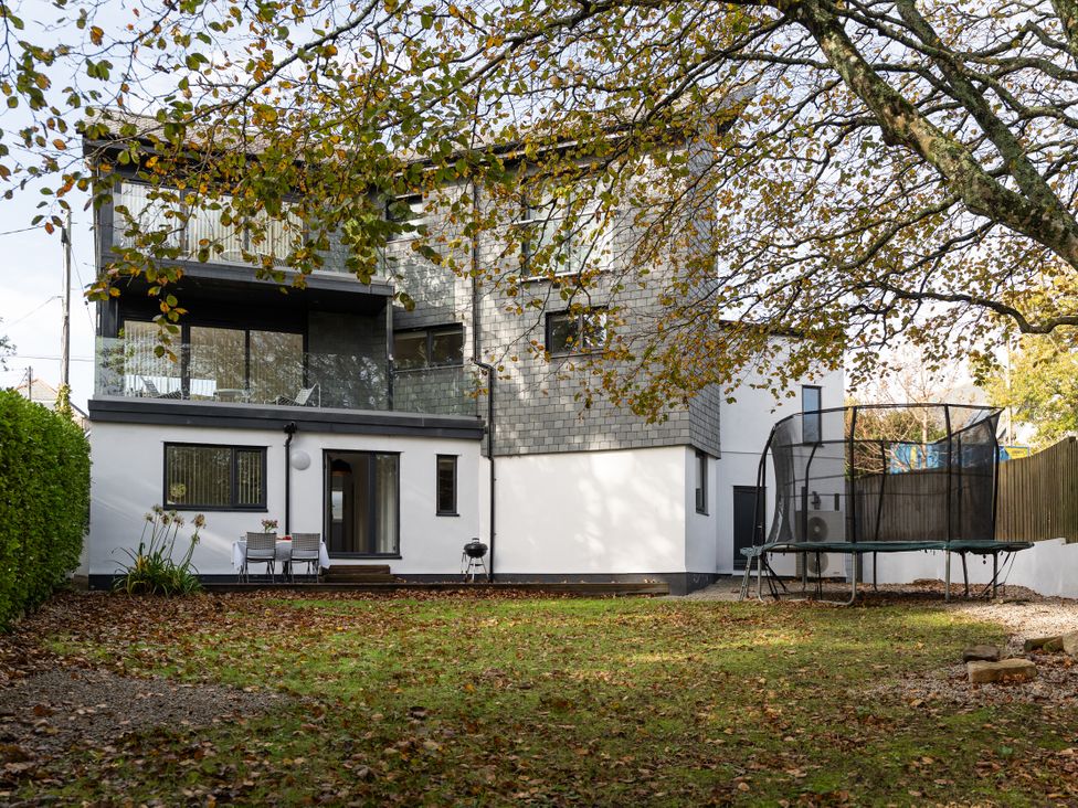 A house with balcony and trampoline in the garden at Estuary Watch Lelant near Carbis Bay