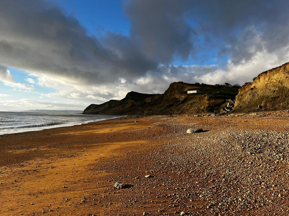 Beach with cliffs and water at Lea Cottage Eype