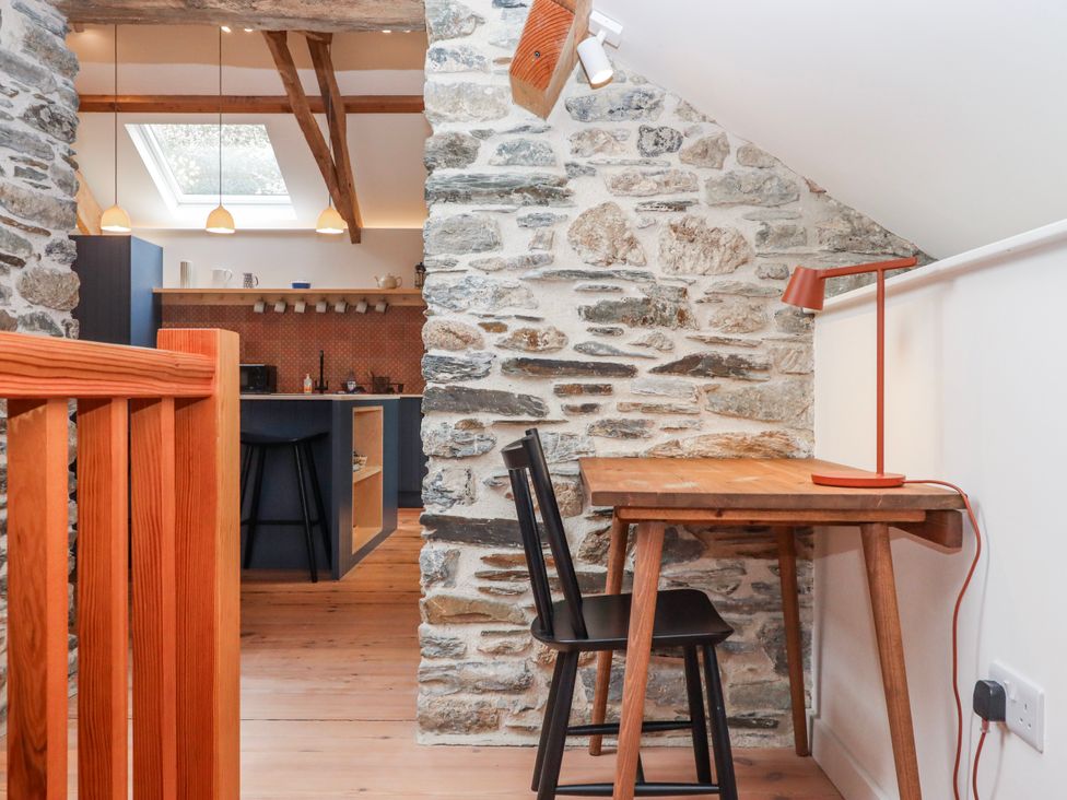 An office with a wooden table and chair at 3 Caddaford Barns in Buckfastleigh