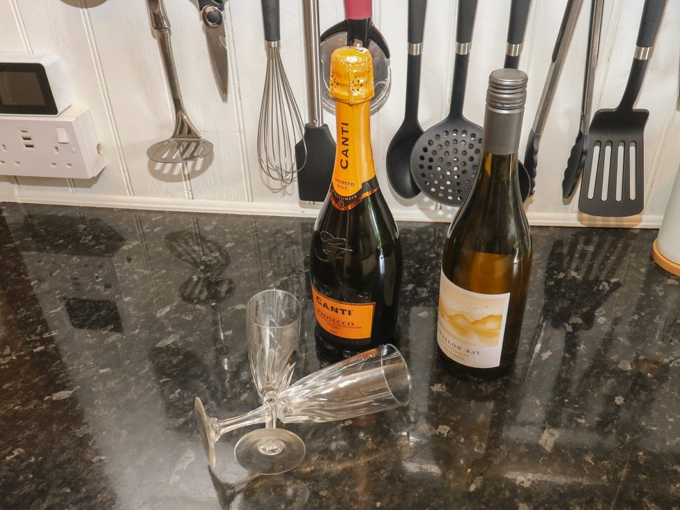 Wine bottles and glasses on a countertop at Prospect Cottage Ripponden