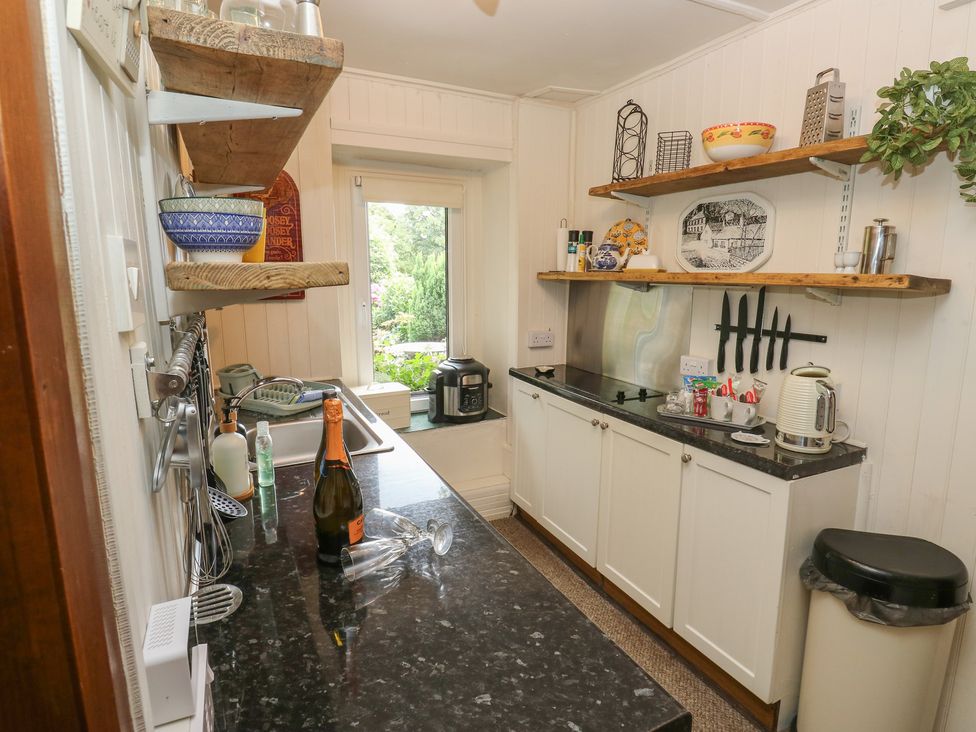 A kitchen with a sink and countertop at Prospect Cottage in Ripponden
