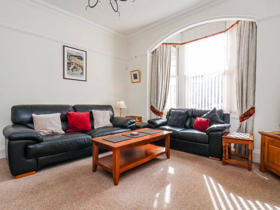 A living room with sofas and a coffee table at 50 West Street Edelweiss Scarborough