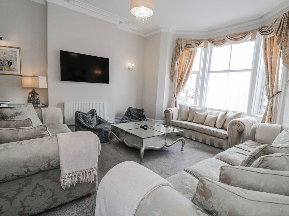 A living room with a sofa and coffee table at The Keep in Llandudno
