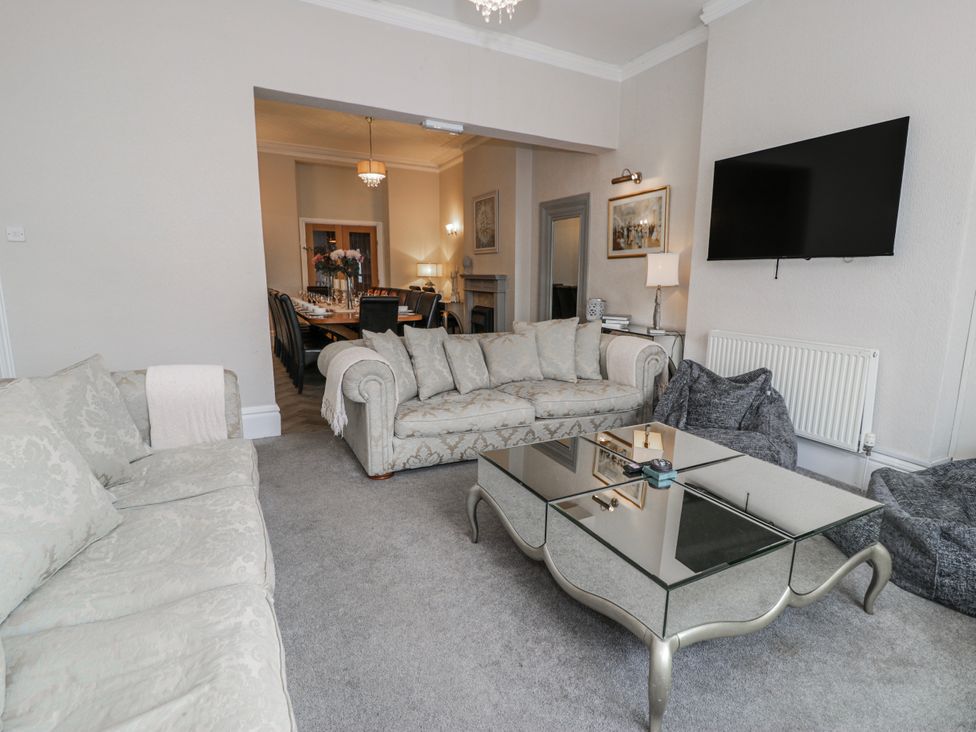 A living room with a sofa and coffee table at The Keep in Llandudno
