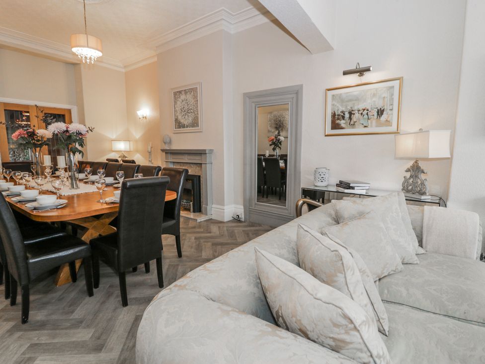 A dining room with a table and chairs at The Keep in Llandudno