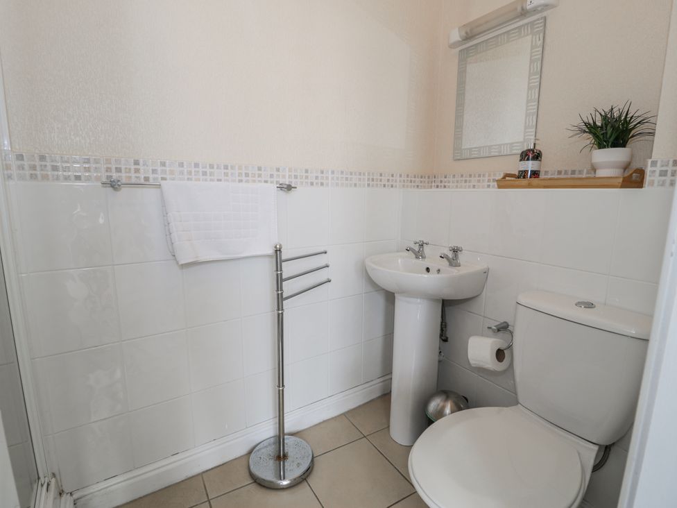 A bathroom with a sink and toilet at The Keep in Llandudno