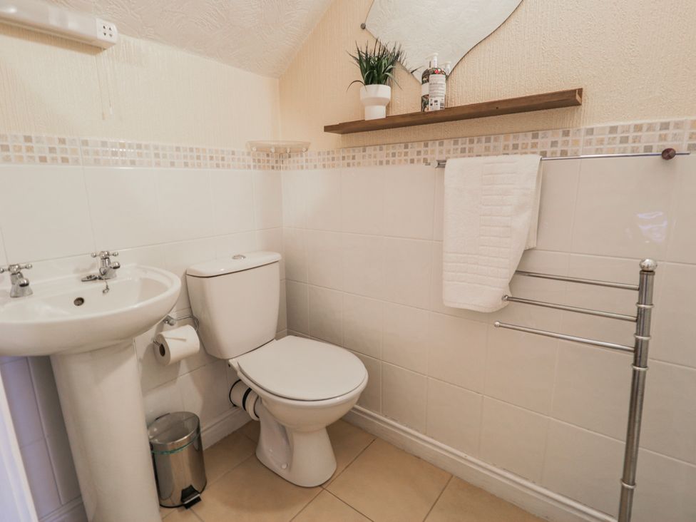 A bathroom with sink and toilet at The Keep in Llandudno