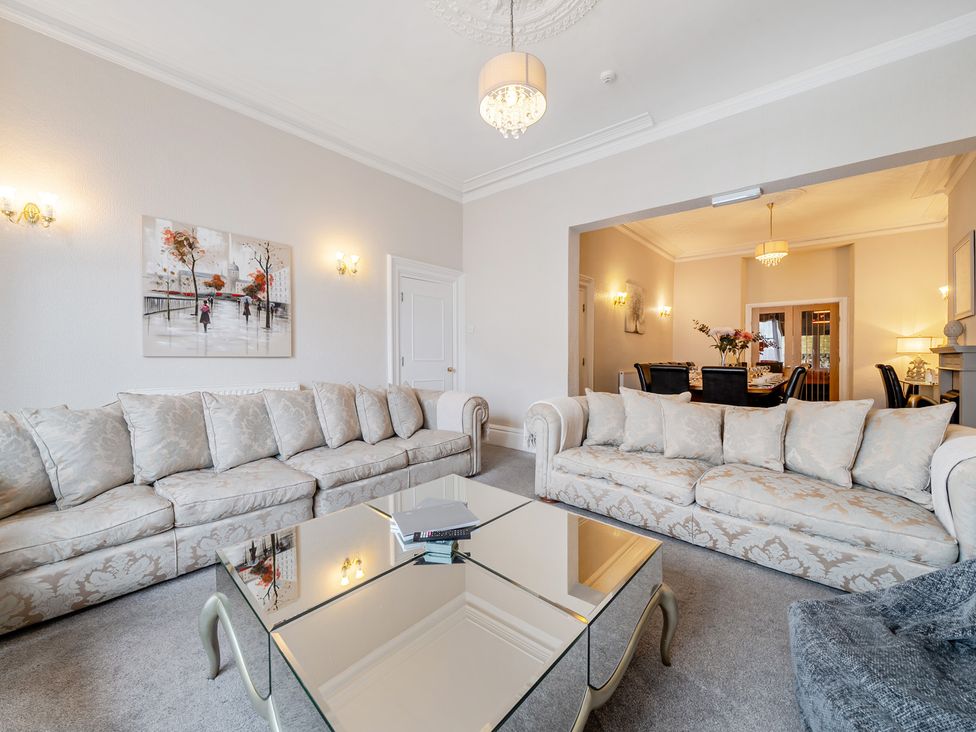 A living room with sofas and a coffee table at The Keep in Llandudno