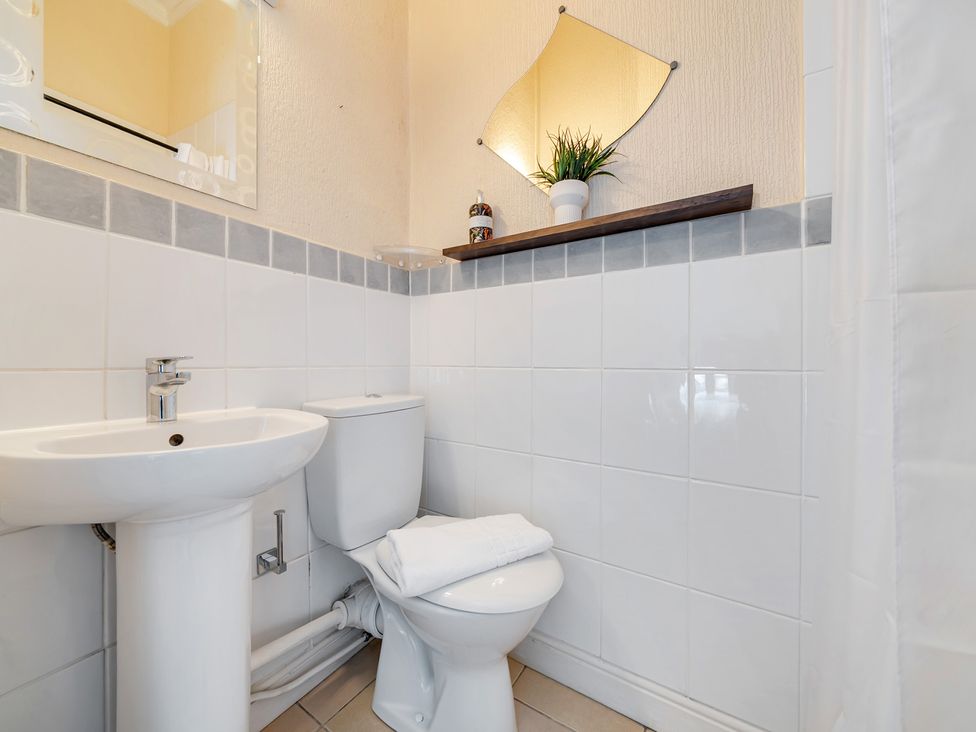 A bathroom with sink and toilet at The Keep in Llandudno