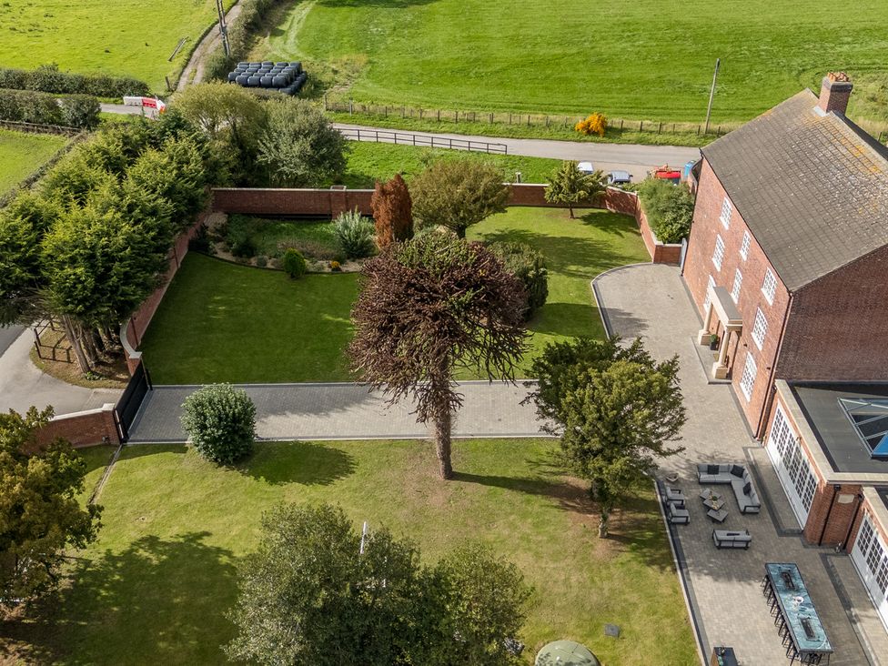 An outdoor view of a garden and house in Otherton Hall Penkridge