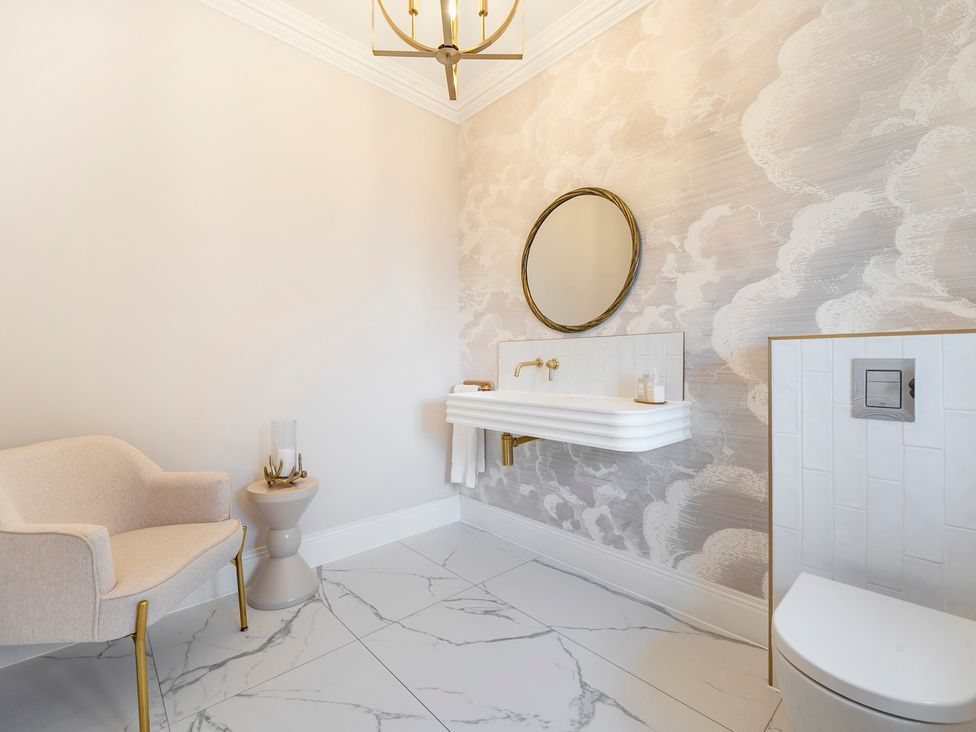 A bathroom with a sink and toilet at Otherton Hall Penkridge