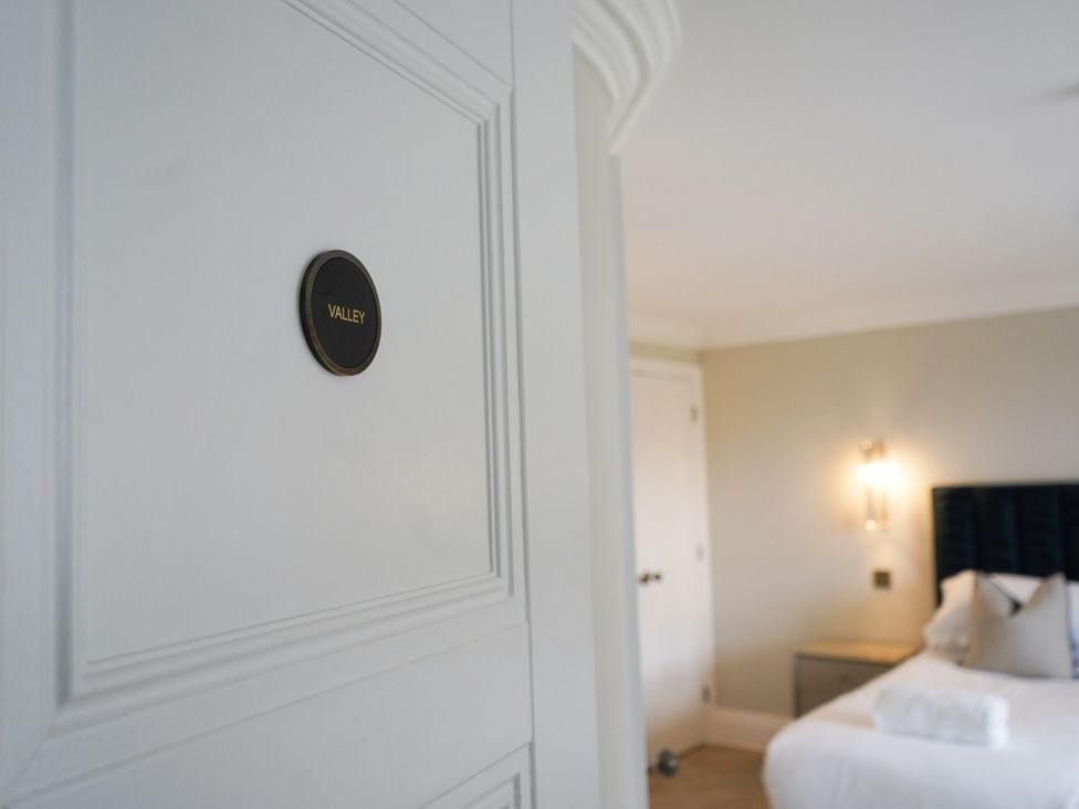 A door with a nameplate in a bedroom at Otherton Hall Penkridge