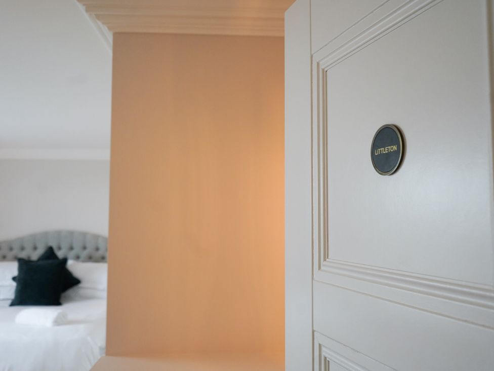 A door with a nameplate in a bedroom at Otherton Hall Penkridge