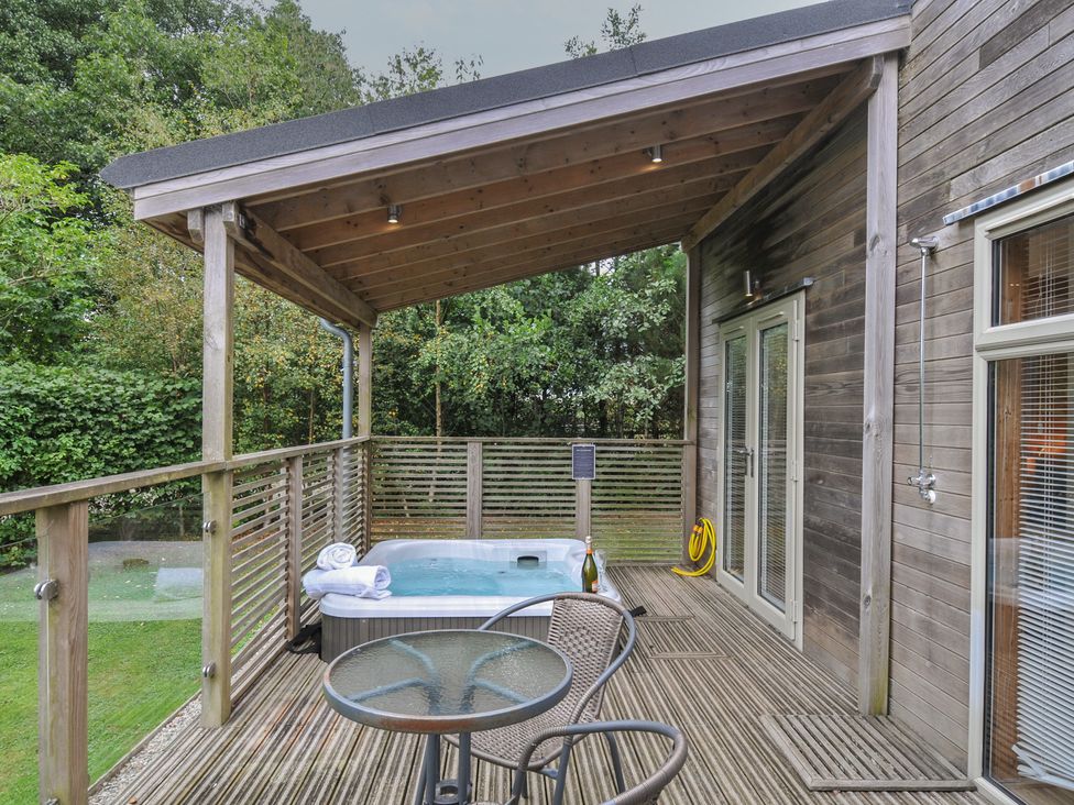 An outdoor area with a hot tub and seating at 3 Southern Place Dobwalls