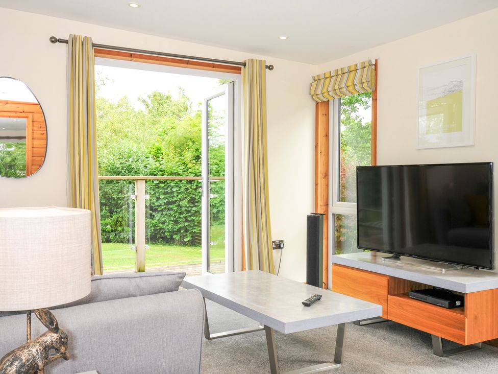 A living room with a TV and coffee table at 5 Faraway Fields in Dobwalls