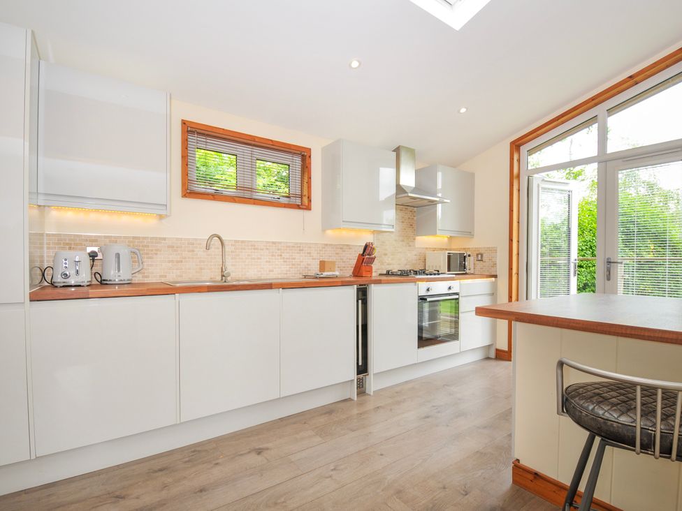 A kitchen with modern appliances and a window at 5 Faraway Fields in Dobwalls