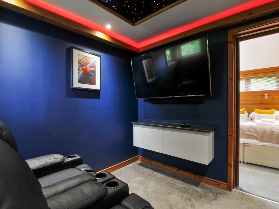 A snug with a television and recliner seating at 5 Faraway Fields in Dobwalls