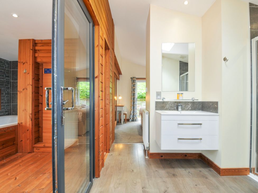A bathroom with a shower and sink at 5 Faraway Fields in Dobwalls