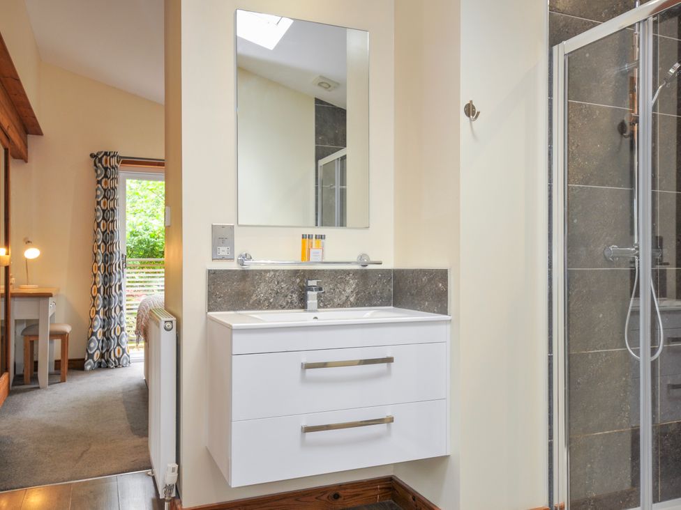 A bathroom with a sink and shower at 5 Faraway Fields in Dobwalls
