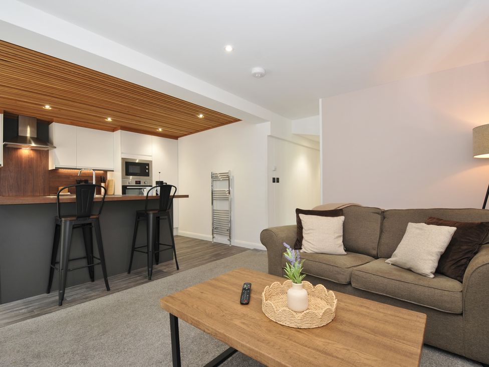 A living room with a sofa and coffee table at 24 Meadow Retreat in Dobwalls