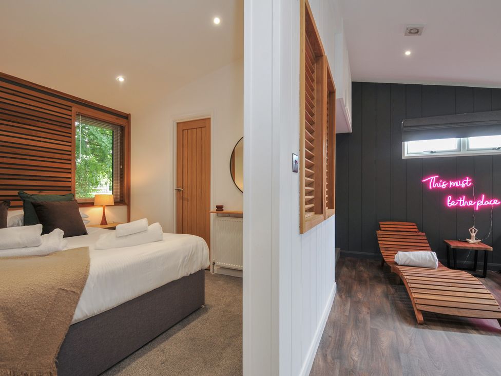 A bedroom with bed and lamp at 24 Meadow Retreat in Dobwalls