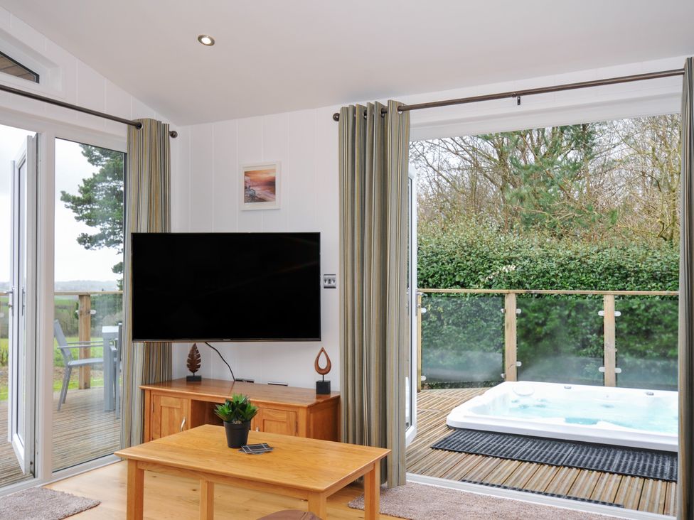 A living room with a television and a jacuzzi at 15 Faraway Fields in Dobwalls