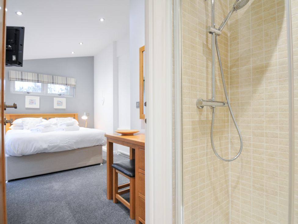 A bedroom with a shower visible and a bed at 15 Faraway Fields Dobwalls