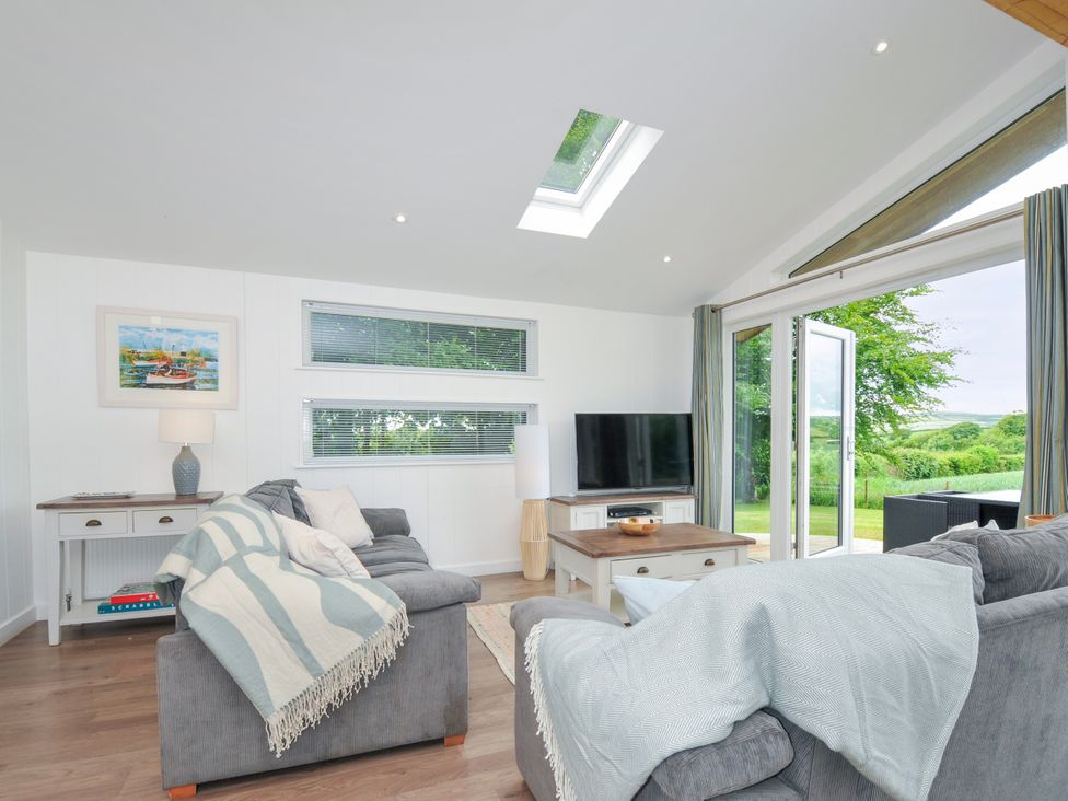 A living room with a sofa and television at 1 Horizon View in Dobwalls