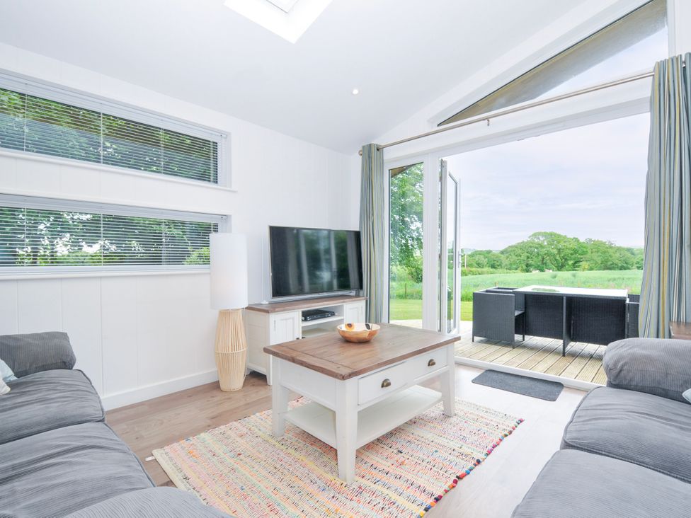 A living room featuring a sofa and television at 1 Horizon View in Dobwalls