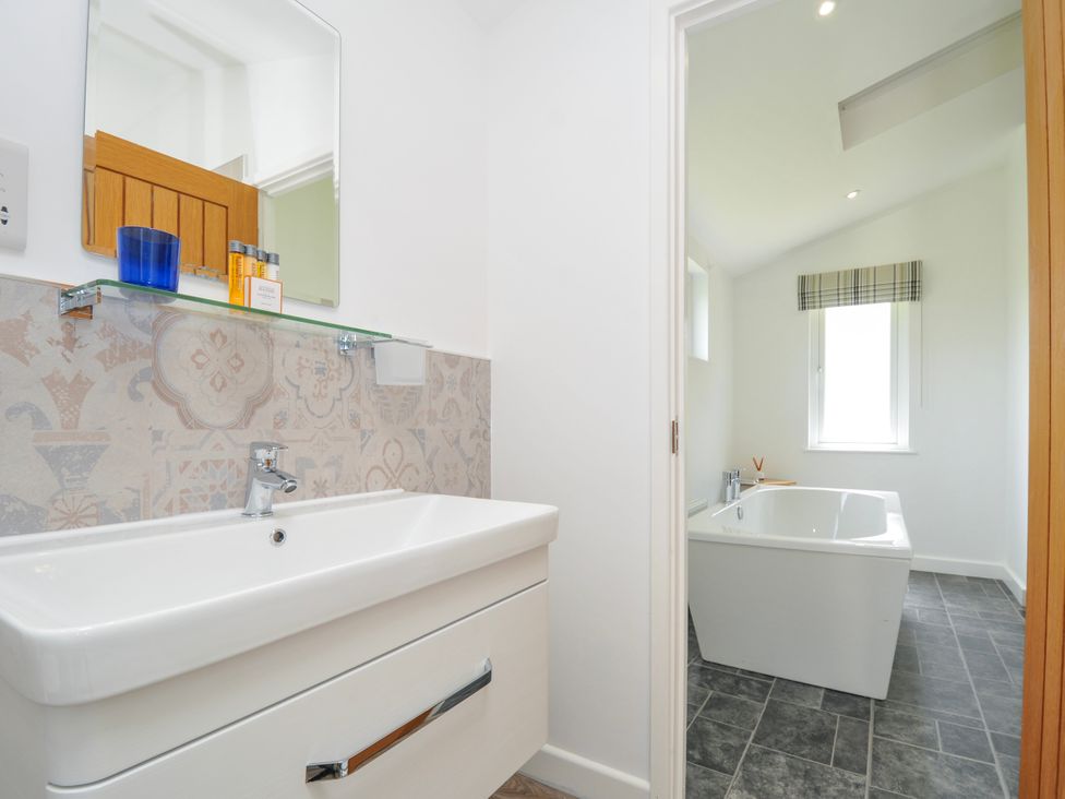 A bathroom with a sink and bathtub at 1 Horizon View in Dobwalls