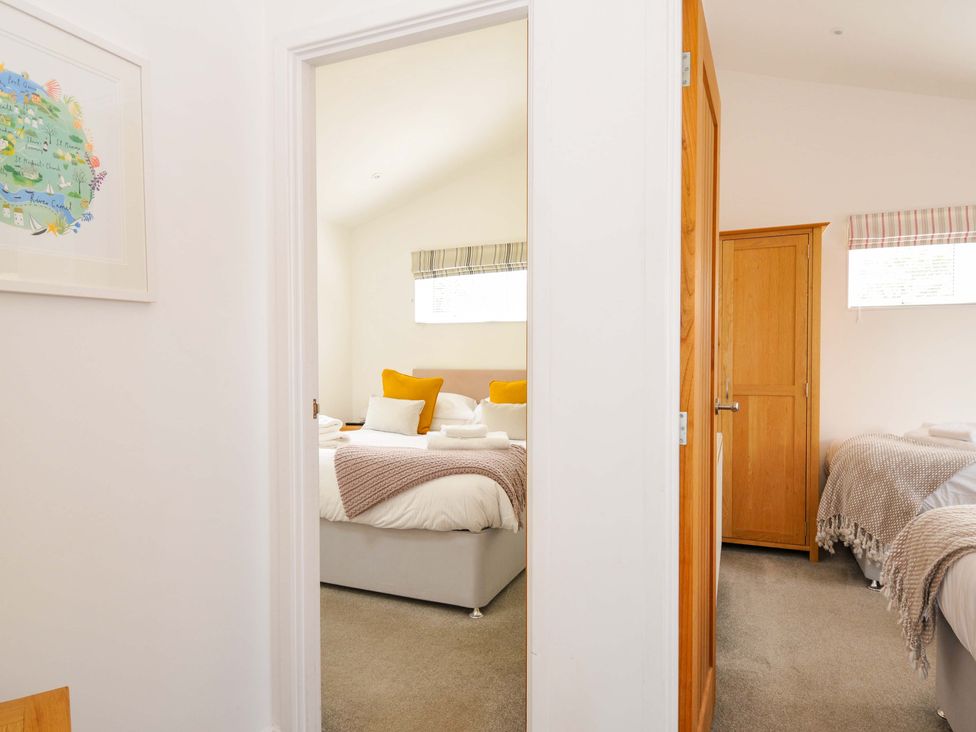 A bedroom with beds and a wardrobe at 3 Horizon View in Dobwalls