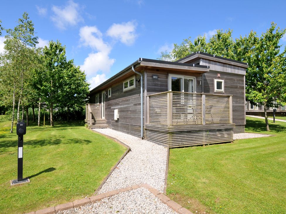 A house with a deck and garden at 12 Meadow Retreat in Dobwalls