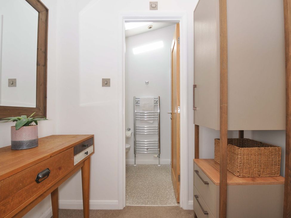 A bathroom with a towel rail and cabinet at 8 Horizon View in Dobwalls