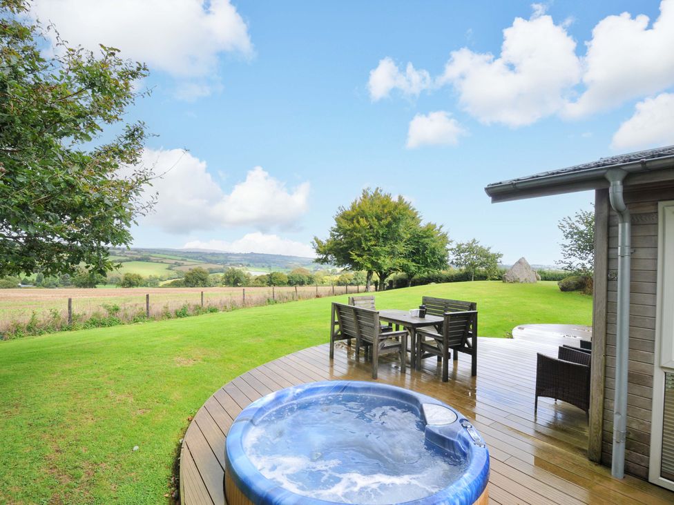 A garden with a hot tub and seating area at 8 Horizon View in Dobwalls