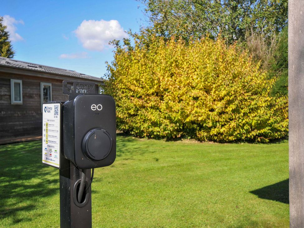 A charging point in a garden area at Energy Park in Dobwalls