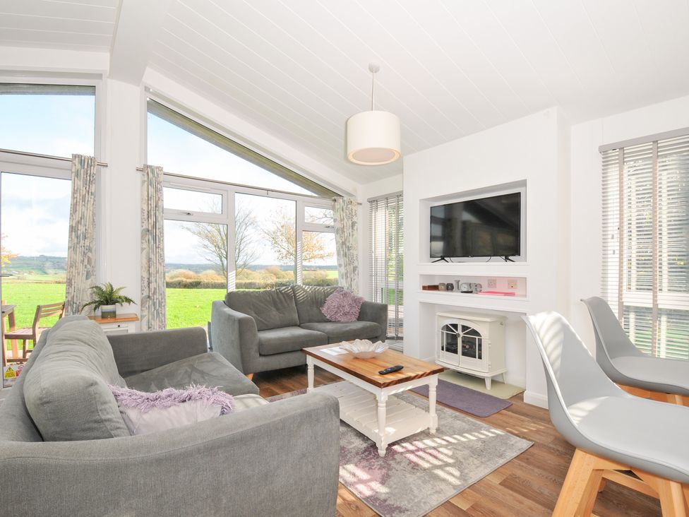 A living room with a sofa and table at 9 Horizon View in Dobwalls