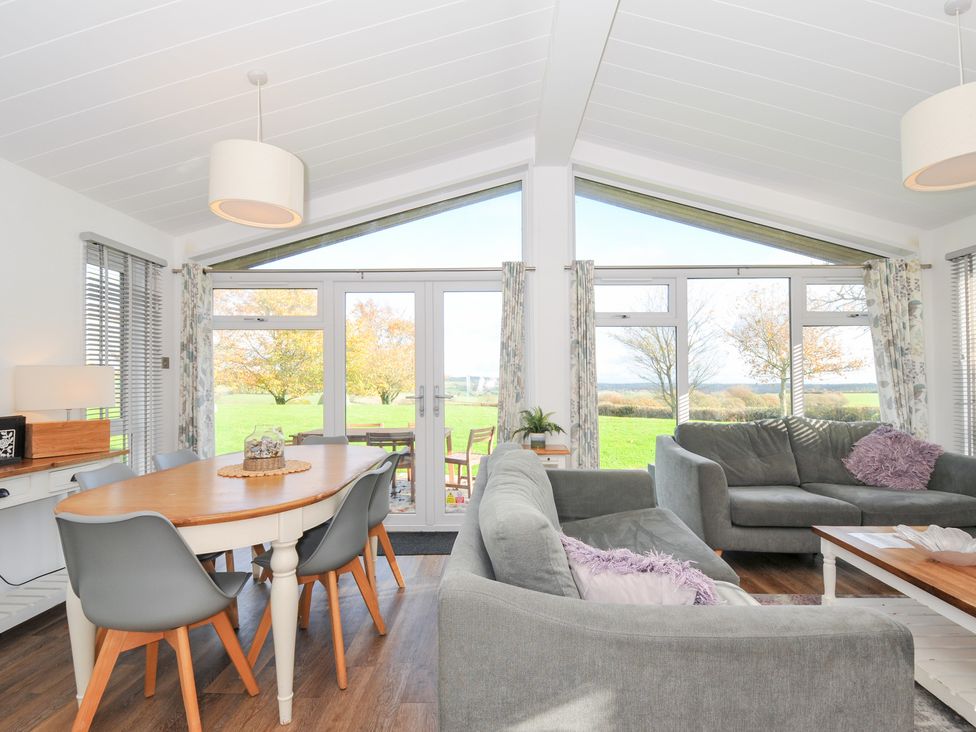 A living room with a dining area and view of the outdoors at 9 Horizon View in Dobwalls
