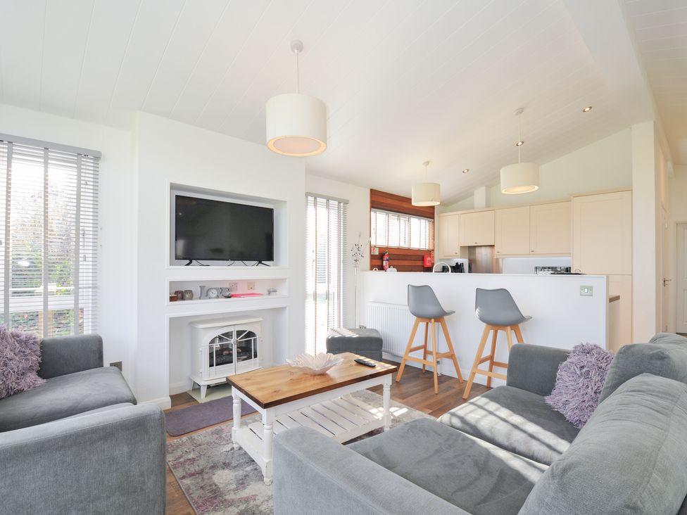 A living room with a television and coffee table at 9 Horizon View in Dobwalls