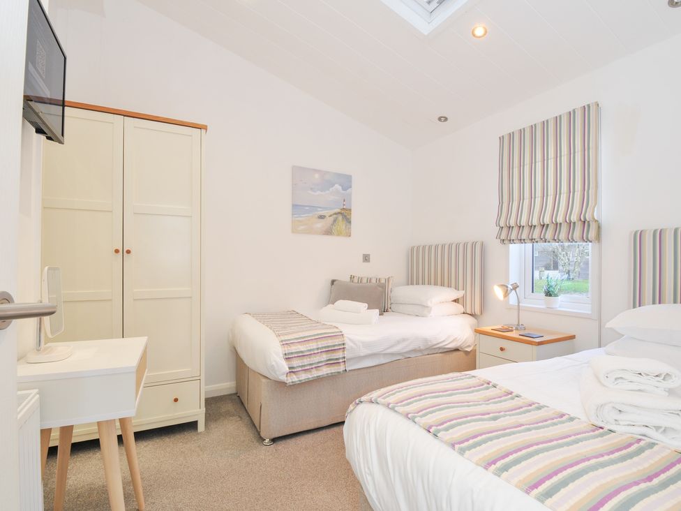 A bedroom with two beds and a wardrobe at 9 Horizon View in Dobwalls