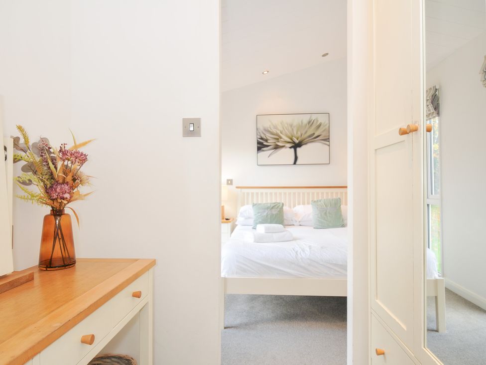 A bedroom featuring a bed and flower artwork at 9 Horizon View in Dobwalls