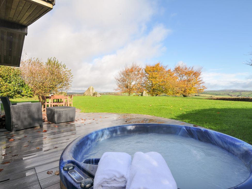 A garden with a hot tub and outdoor furniture at 9 Horizon View in Dobwalls