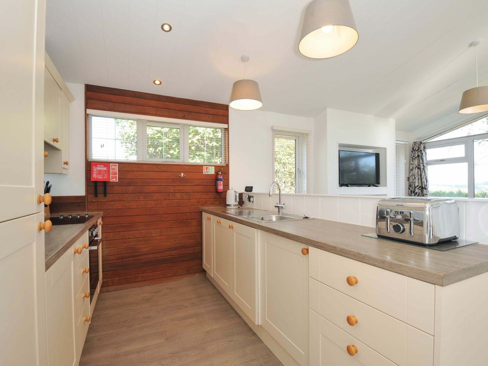 A kitchen with cabinets and a toaster at 10 Horizon View in Dobwalls