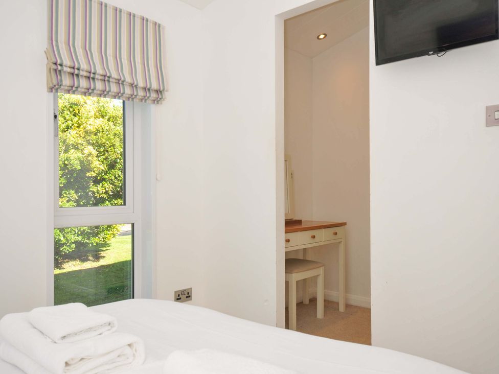 A bedroom with a desk and chair at 10 Horizon View Dobwalls