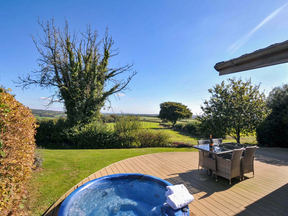 A hot tub and seating area overlooking a landscape at 10 Horizon View in Dobwalls