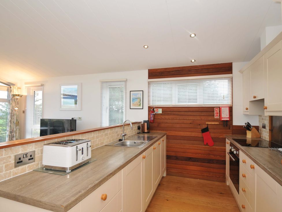 A kitchen with a sink and appliances at 11 Horizon View in Dobwalls