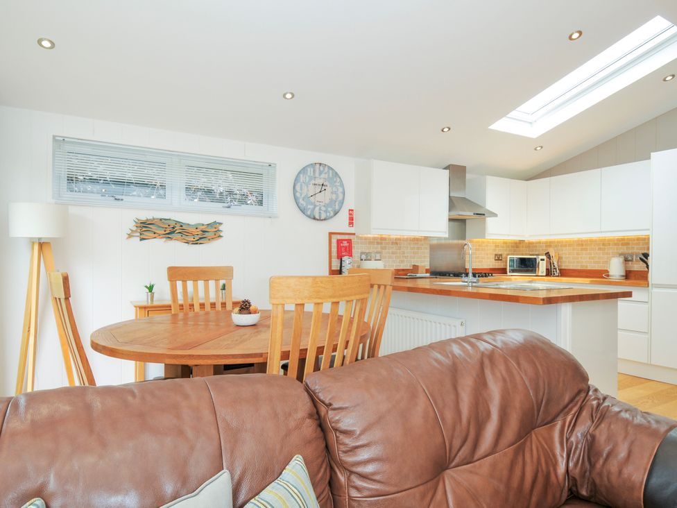 A kitchen with a dining table and chairs at 15 Horizon View Dobwalls