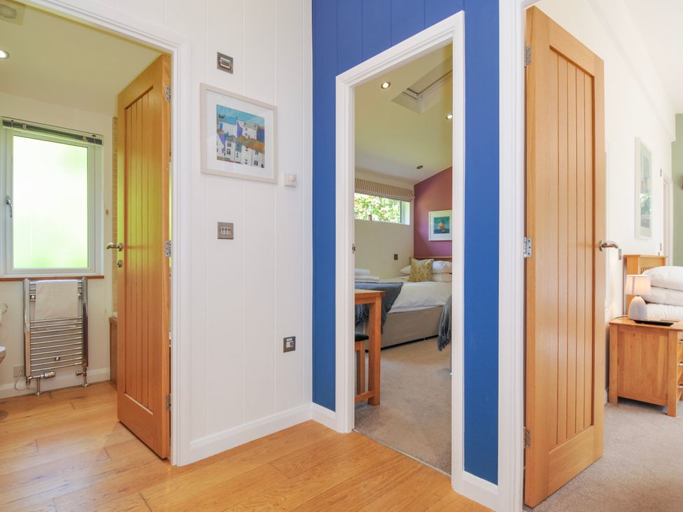 A hallway with doors to bathroom and bedroom at 15 Horizon View in Dobwalls