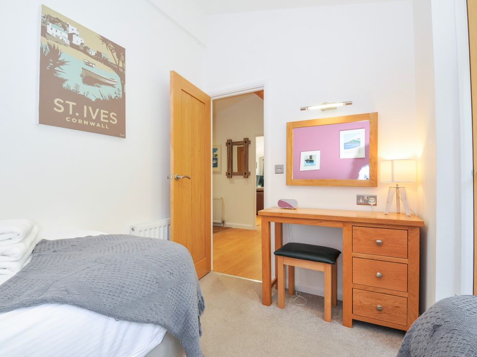 A bedroom with a bed and desk at 15 Horizon View Dobwalls
