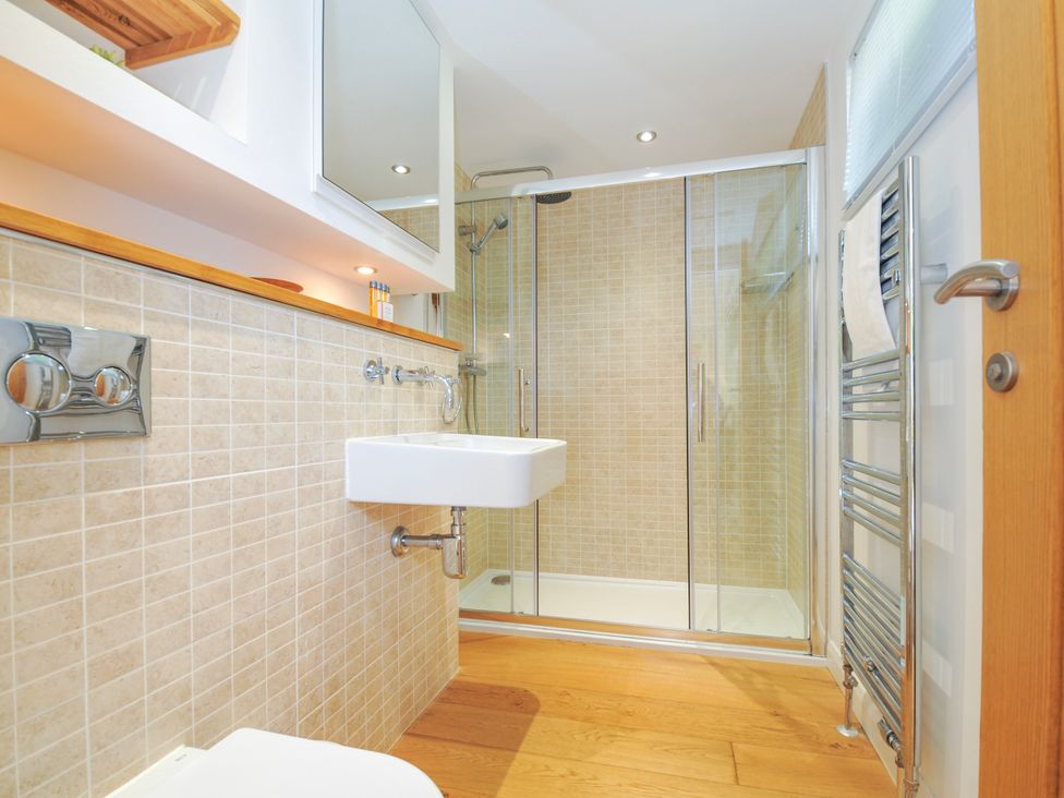 A bathroom with a sink, shower, and towel rail at 15 Horizon View in Dobwalls